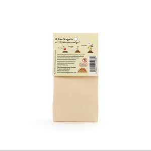 Sac en papier brun avec une étiquette indiquant « 8 boules de graines avec graines de fleurs sauvages », ainsi que des illustrations et des informations sur le produit en allemand.