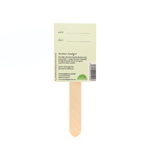 Dos d'un bâtonnet de graines de concombre en bois avec les étiquettes « de » et « pour » et les informations sur le produit.