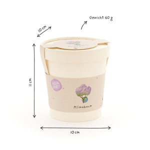Tasse beige avec couvercle, étiquetée « Arbre Climat », dimensions dessinées à la main (10 cm de diamètre, 11 cm de hauteur) et poids (60 g) sur fond blanc.