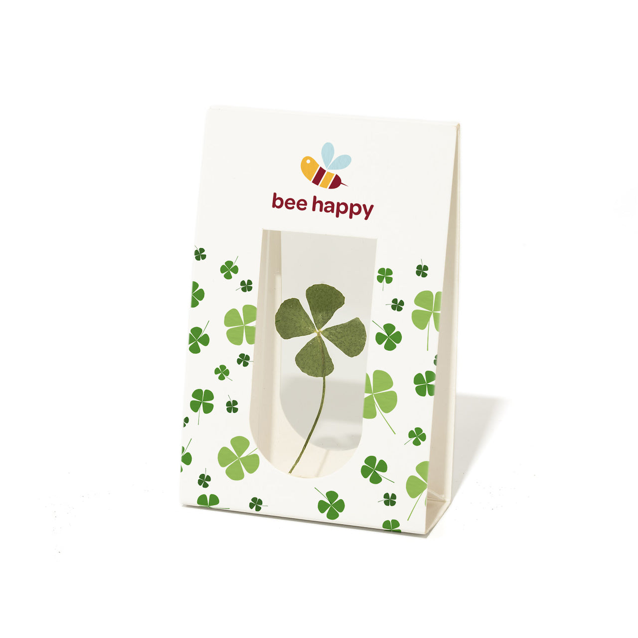 Sac en papier avec un trèfle à quatre feuilles et le texte « bee happy » ainsi qu'une illustration d'abeille.