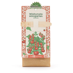 Kit de culture « Wild Tomato Mini Garden » de Die Stadtgärtner, emballage avec illustration d'un plant de tomate et tuteur en bois.
