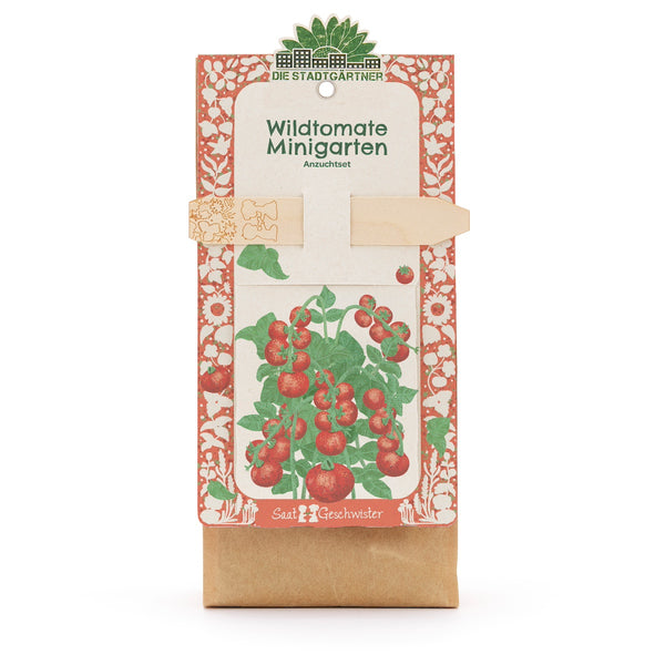 Kit de culture « Wild Tomato Mini Garden » de Die Stadtgärtner, emballage avec illustration d'un plant de tomate et tuteur en bois.