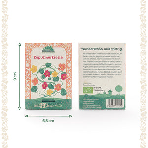 Deux paquets de graines de capucine avec des illustrations de fleurs colorées, une description et des dimensions de 9 x 6,5 cm sur fond clair.