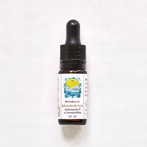 Flacon avec pipette sur fond clair, étiquette indiquant « Baume pour l'âme de Niendorf, huile anti-stress pour égayer l'humeur, 10 ml ».