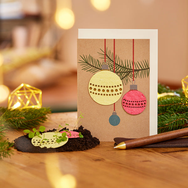 Carte de Noël avec 3 boules de Noël en papier ensemencé