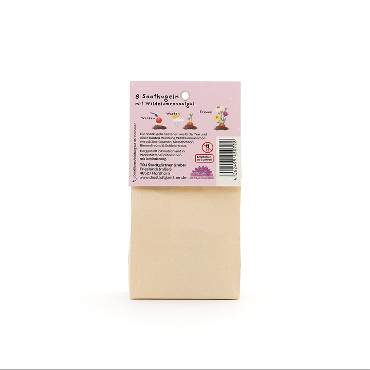 Sac en papier brun avec une étiquette en allemand décrivant « 8 boules de graines avec des graines de fleurs sauvages ».