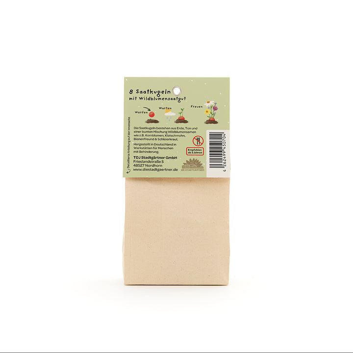 Sac en papier avec étiquette verte indiquant des informations sur 8 boules de graines contenant des graines de fleurs sauvages.