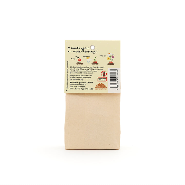 Sac en papier brun avec une étiquette indiquant « 8 boules de graines avec graines de fleurs sauvages », ainsi que des illustrations et des informations sur le produit en allemand.