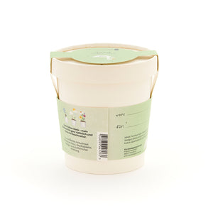 Pot de fleurs beige avec étiquette verte, inscription et illustrations de plantes, dos avec espace pour étiqueter "de" et "pour".