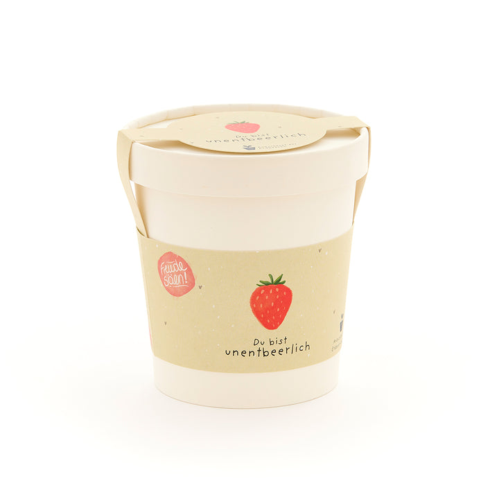 Emballage blanc avec une illustration de fraise et l’inscription « Vous êtes indispensable ».