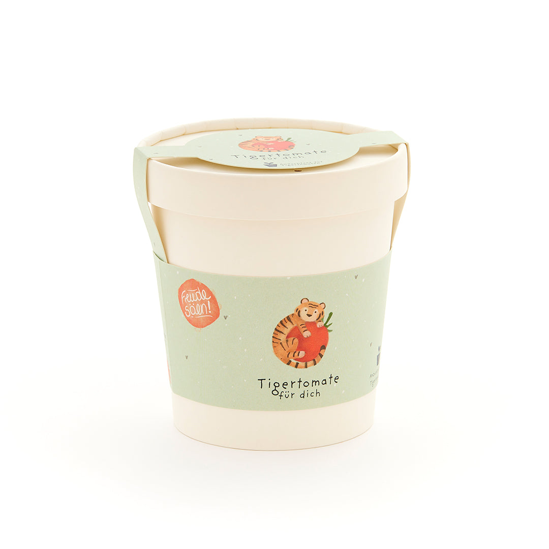 Tasse avec une étiquette verte représentant un tigre avec une tomate et le texte « Tiger tomato for you ».