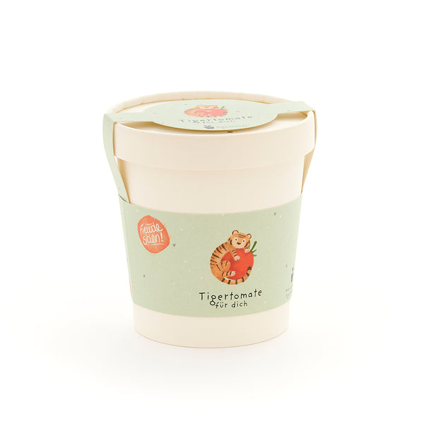 Tasse avec une étiquette verte représentant un tigre avec une tomate et le texte « Tiger tomato for you ».