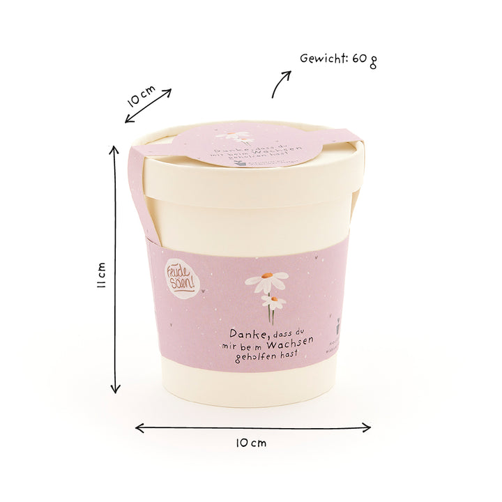 Mug avec une banderole violette, un motif de marguerite et l'inscription "Merci de m'avoir aidé à grandir", à côté les dimensions (10 cm x 10 cm x 11 cm) et le poids (60 g).