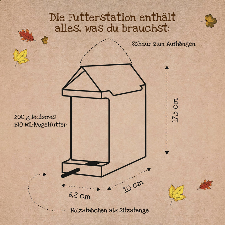 Croquis d'une mangeoire avec des étiquettes en allemand indiquant les dimensions et les composants tels que la ficelle pour suspendre, des bâtons en bois comme perchoir et 200 g de nourriture biologique pour oiseaux sauvages.