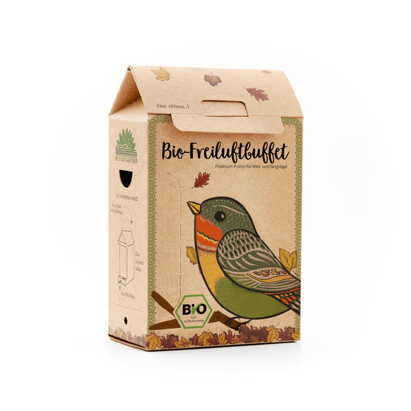 Emballage en carton avec un dessin d'oiseau coloré et l'inscription « Buffet Bio en Plein Air », nourriture haut de gamme pour oiseaux sauvages et chanteurs.