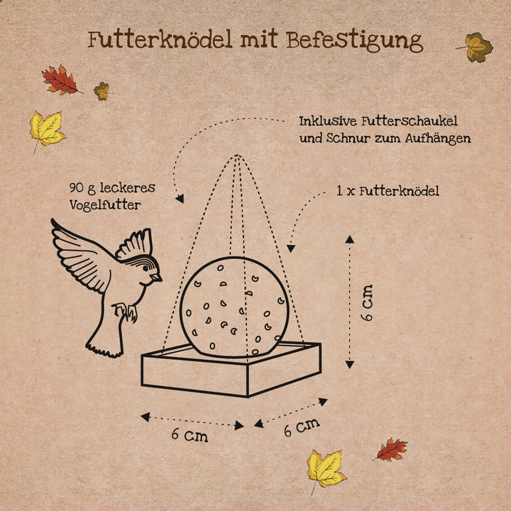 Illustration d'une boulette alimentaire avec accessoire, dessin d'oiseau, dimensions 6x6x6 cm, feuilles d'automne et étiquettes allemandes.