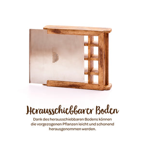 Coffre en bois avec base métallique coulissante, adapté pour retirer délicatement les plantes.