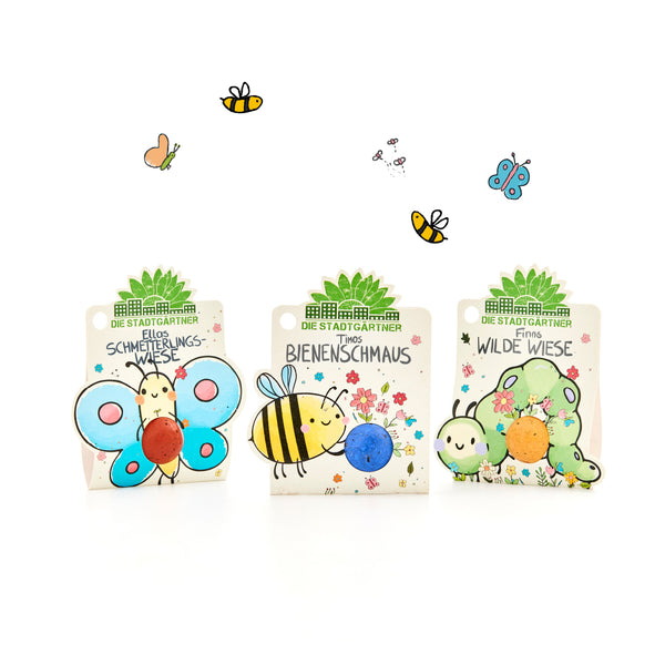 Trois sachets de graines colorées de « The City Gardeners » avec des illustrations de papillons, d'abeilles et de chenilles, décorés de fleurs et de petits insectes.