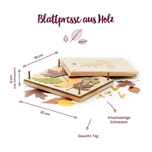 Presse à feuilles en bois avec feuilles colorées, quatre vis et dimensions 25 x 19 x 6 cm, poids 1 kg.