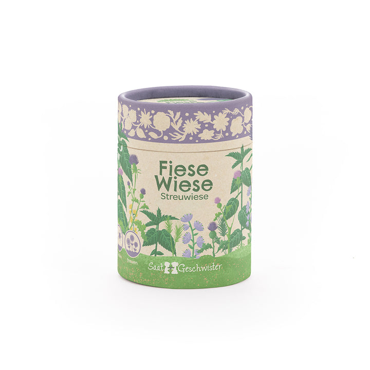 Boîte ronde avec l'inscription "Fiese Wiese Streuwiese" et des illustrations florales, produit de SaatGeschwister.