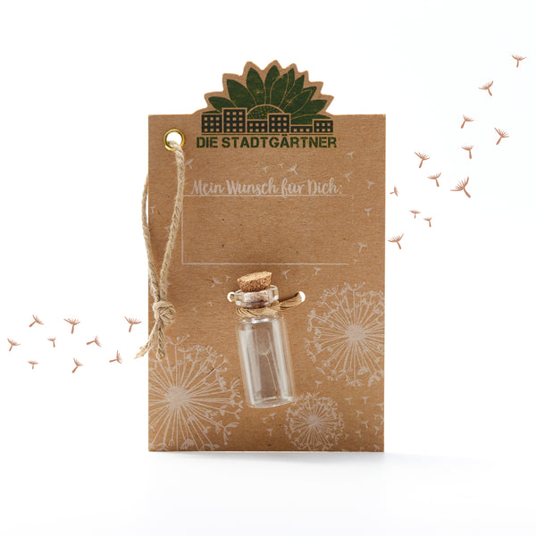 Carte marron avec l'inscription « Les Jardiniers de la Ville », une petite bouteille en verre et des pissenlits illustrés.