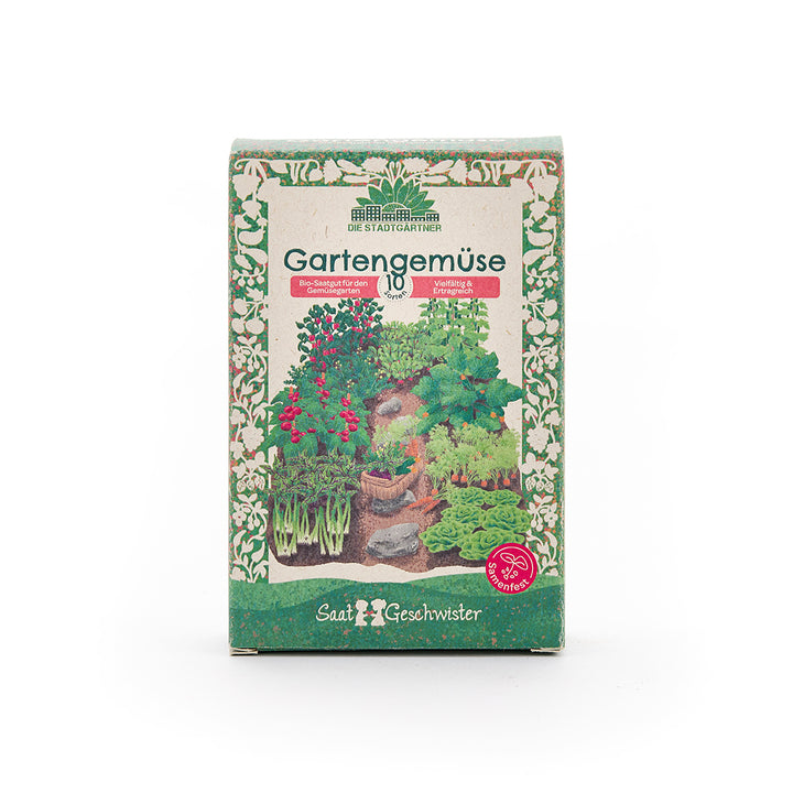 Paquet de semences de légumes de jardin biologiques, illustré de diverses plantes potagères et d'une bordure décorative verte.