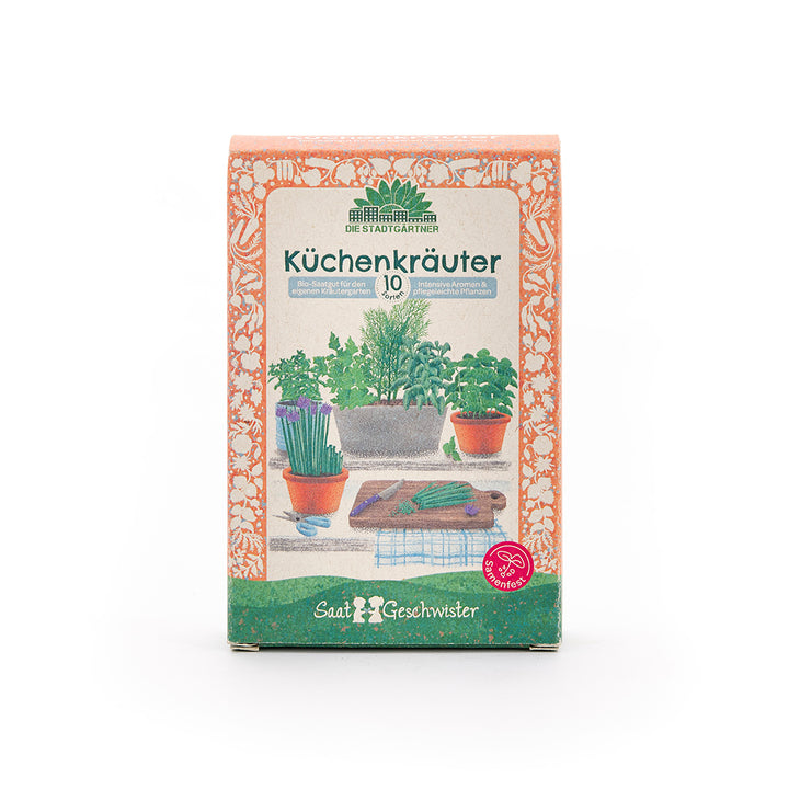 Emballage pour graines d'herbes culinaires avec illustrations de pots d'herbes et une planche à découper sur le devant.