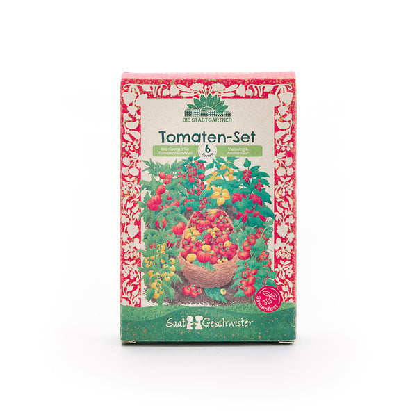 Emballage d'un ensemble de tomates avec un motif de tomate coloré et l'inscription « Ensemble de tomates – 6 variétés – Graines biologiques pour les amateurs de tomates » en allemand.