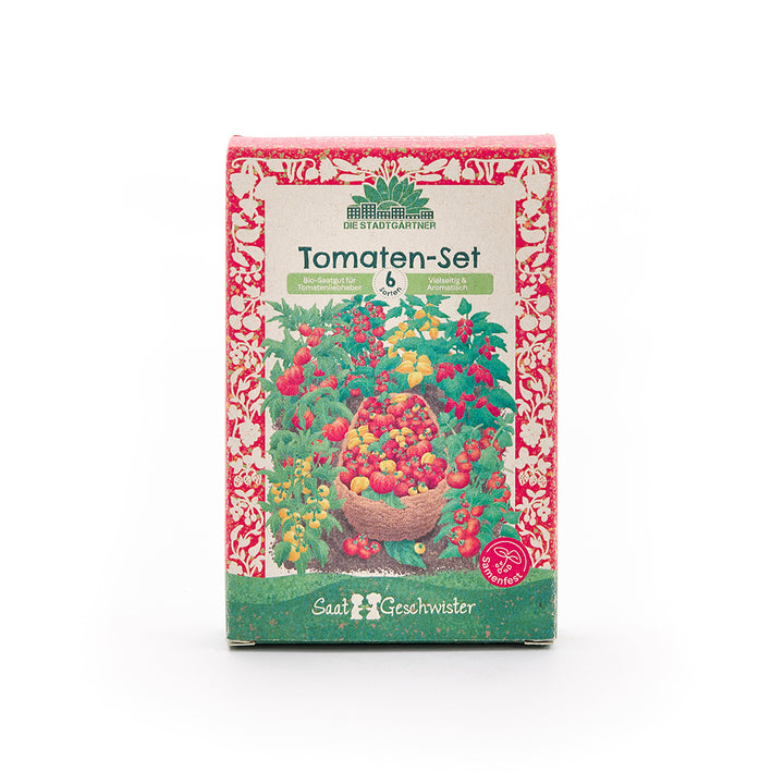Emballage d'un ensemble de tomates avec un motif de tomate coloré et l'inscription « Ensemble de tomates – 6 variétés – Graines biologiques pour les amateurs de tomates » en allemand.