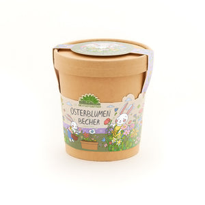 Pot de fleurs marron avec des décorations de Pâques colorées et l'inscription « Easter Flowers Cup », illustrée de fleurs et d'un lapin.