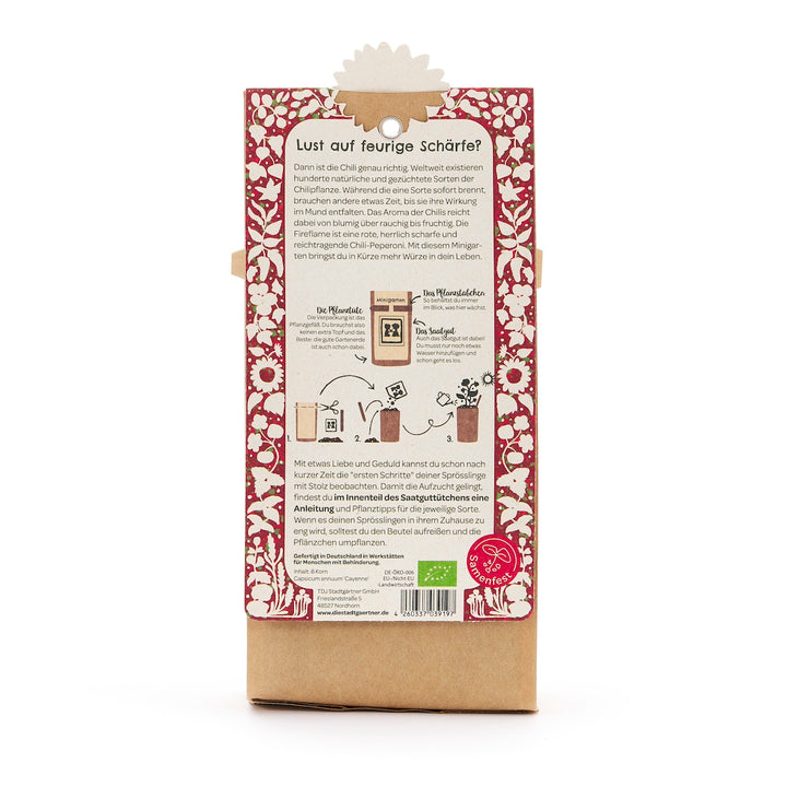 Dos d'un emballage contenant des instructions pour planter du piment, entouré d'un motif floral rouge, avec texte et illustrations en allemand.