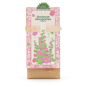 Kit de culture de mini-jardin de roses trémières avec illustration de fleurs colorées sur l'emballage.