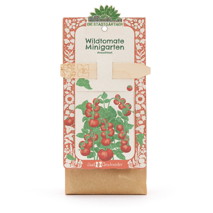 Kit de culture « Wild Tomato Mini Garden » de Die Stadtgärtner, emballage avec illustration d'un plant de tomate et tuteur en bois.