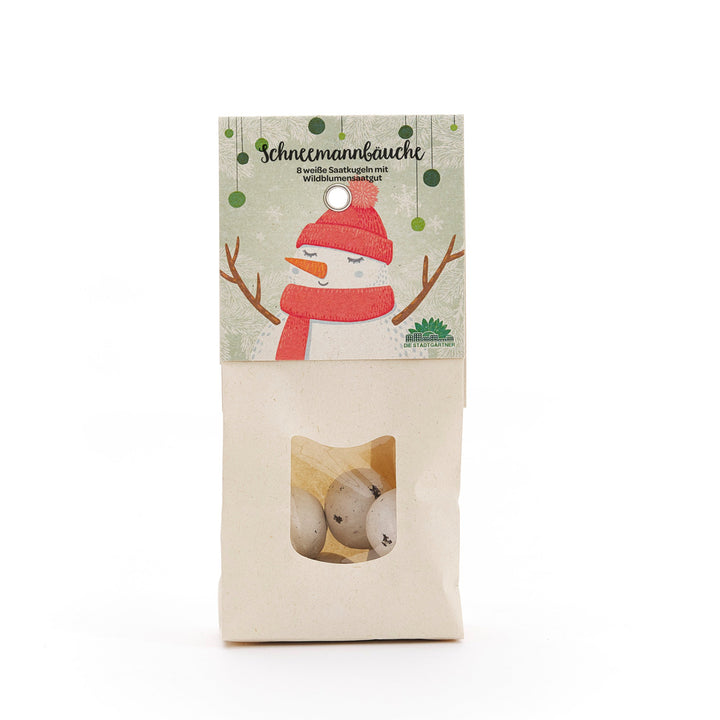Sac en papier avec fenêtre, contenant des boules de graines blanches, emballage avec une illustration de bonhomme de neige et l'inscription "Snowman Bellies - 8 boules de graines blanches avec graines de fleurs sauvages".