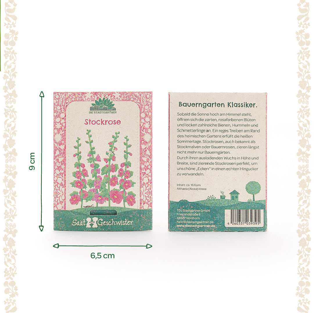 Deux sachets de graines de roses trémières de Saatgeschwister, l'un avec une illustration des fleurs et l'autre avec une description en allemand ; dimensions 9 cm de haut et 6,5 cm de large.